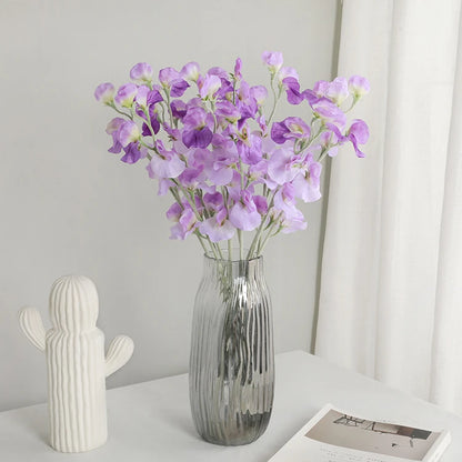 silk sweet pea flowers in a vase