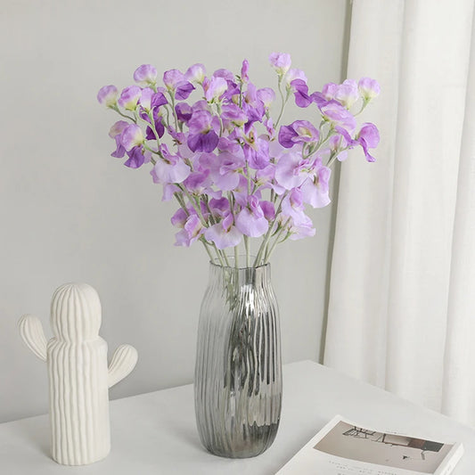 silk sweet pea flowers in a vase