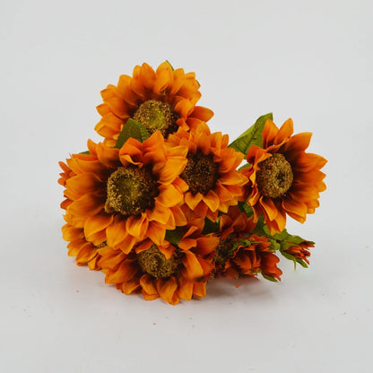 an artificial sunflower bouquet on its side