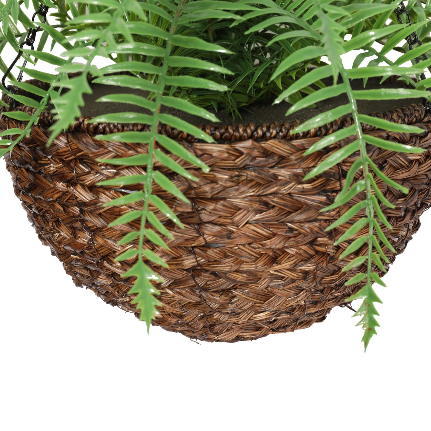 a close up on the basket holding the artificial fern