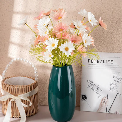 a bouquet of silk daisies in various colors