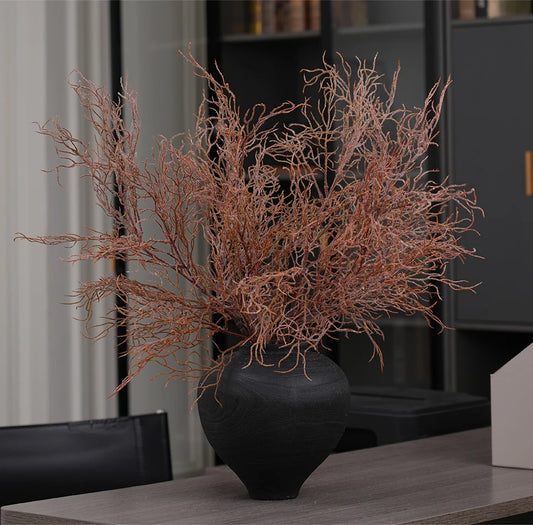 artificial coral grass showcased in a vase