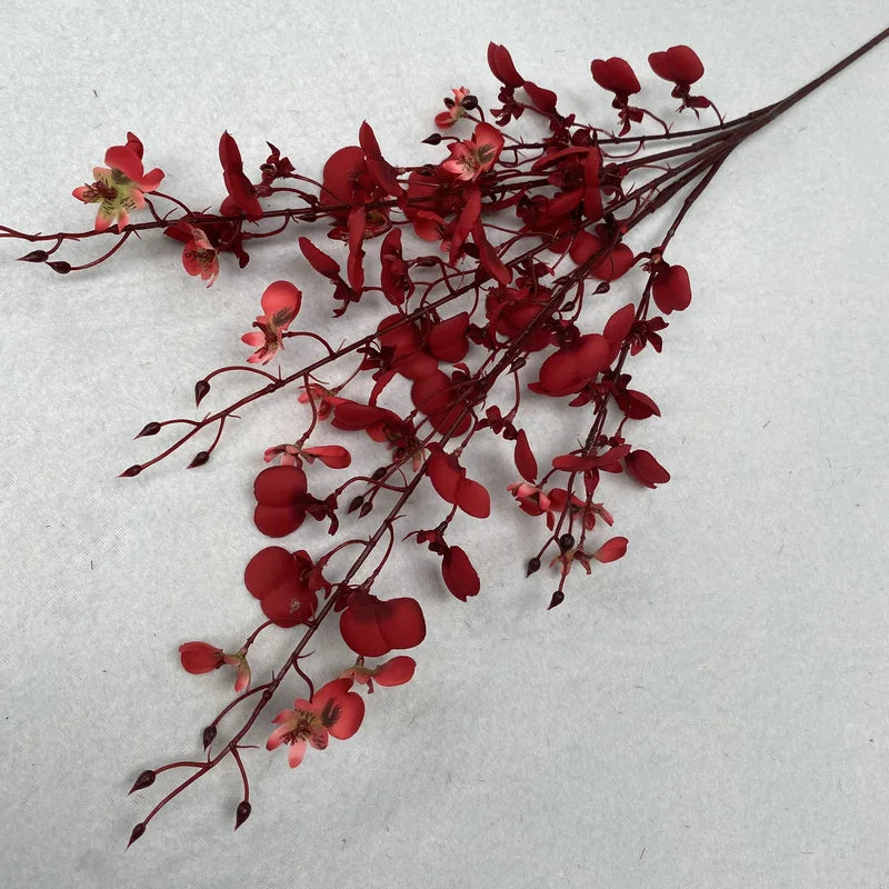a silk orchid sprig on its side